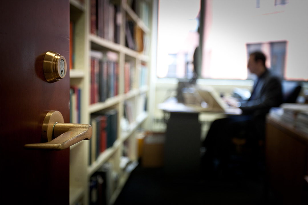outside the door perspective of a professor working in his office