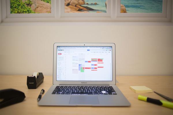 A laptop displaying a calendar on its screen